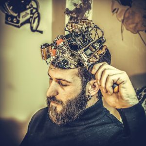 Brain function - Image of a man with a machine in the top of his skull