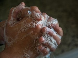 Image of sudsy wet hands, helps prevent cold sores