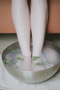 Image of a woman's feet in a tub of water