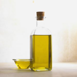 Image of a jar and small dish of oil