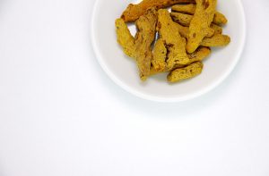Curcumin - A bowl of turmeric rhizomes